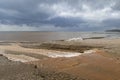 The beach of BenicÃÂ ssim-BenicÃÂ¡sim and the Mediterranean Sea joining with rainwater and floods producing a mixture of sediments l